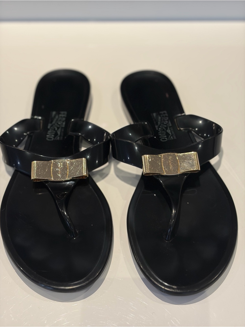Salvatore Ferragamo Black Jelly  Sandals with Gold Bow Accent